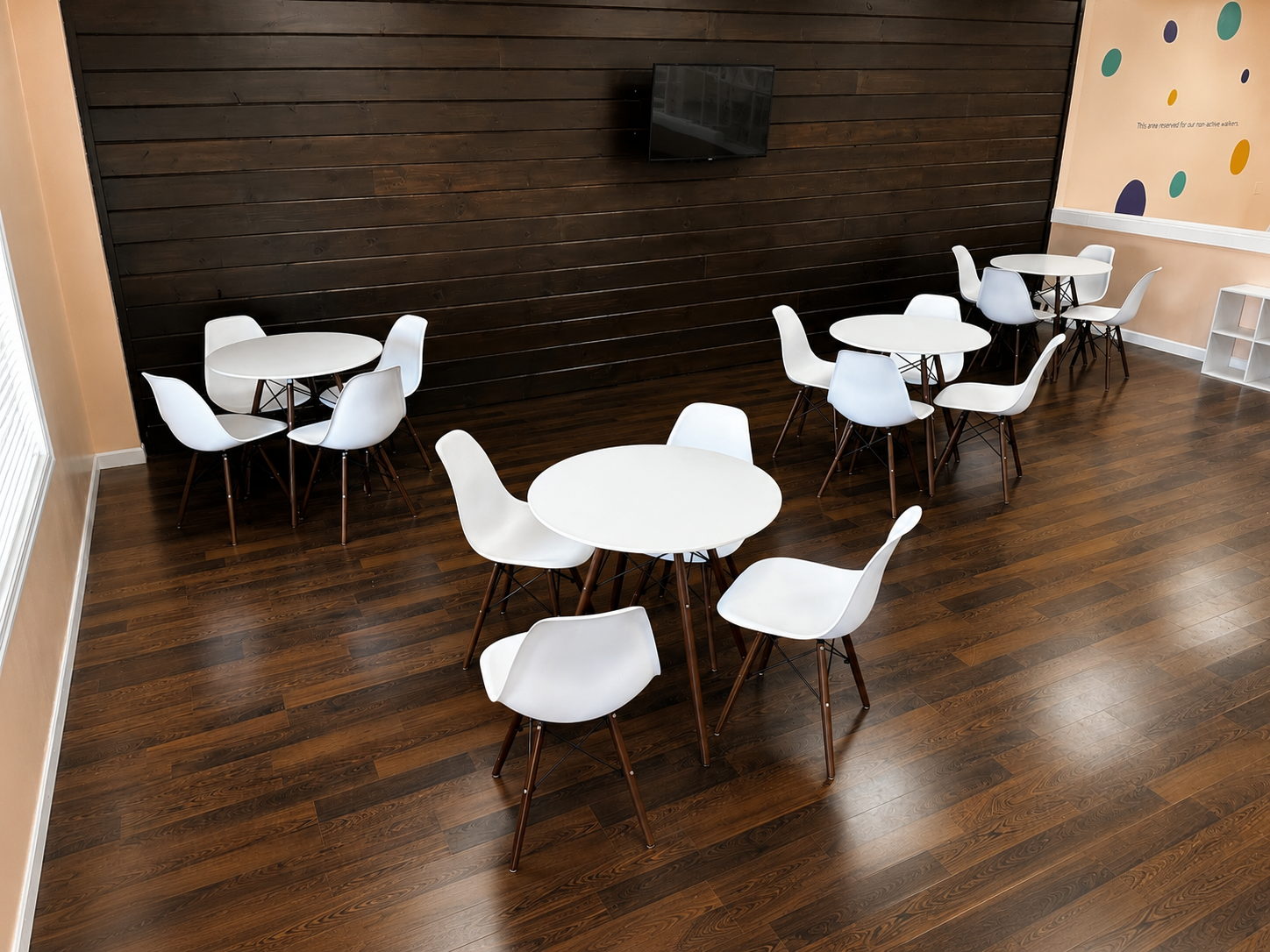The café at Little Beans — clean tables, warm space, clear view of the play area